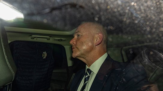 Catholic Schools NSW CEO Dallas McInerney is chaperoned from ICAC after giving evidence on Thursday.
