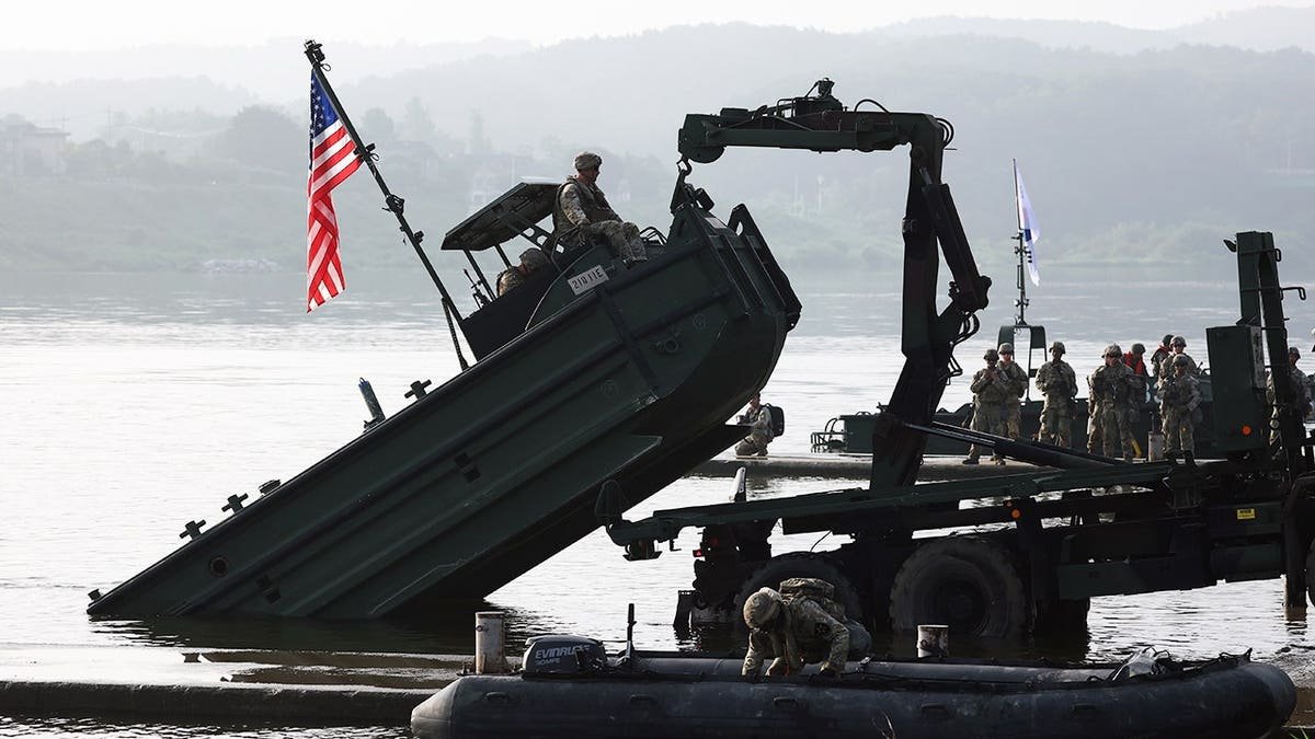 U.S. soldiers from the 2nd Infantry Division cross a river during the Ulchi Freedom Shield exercise.
