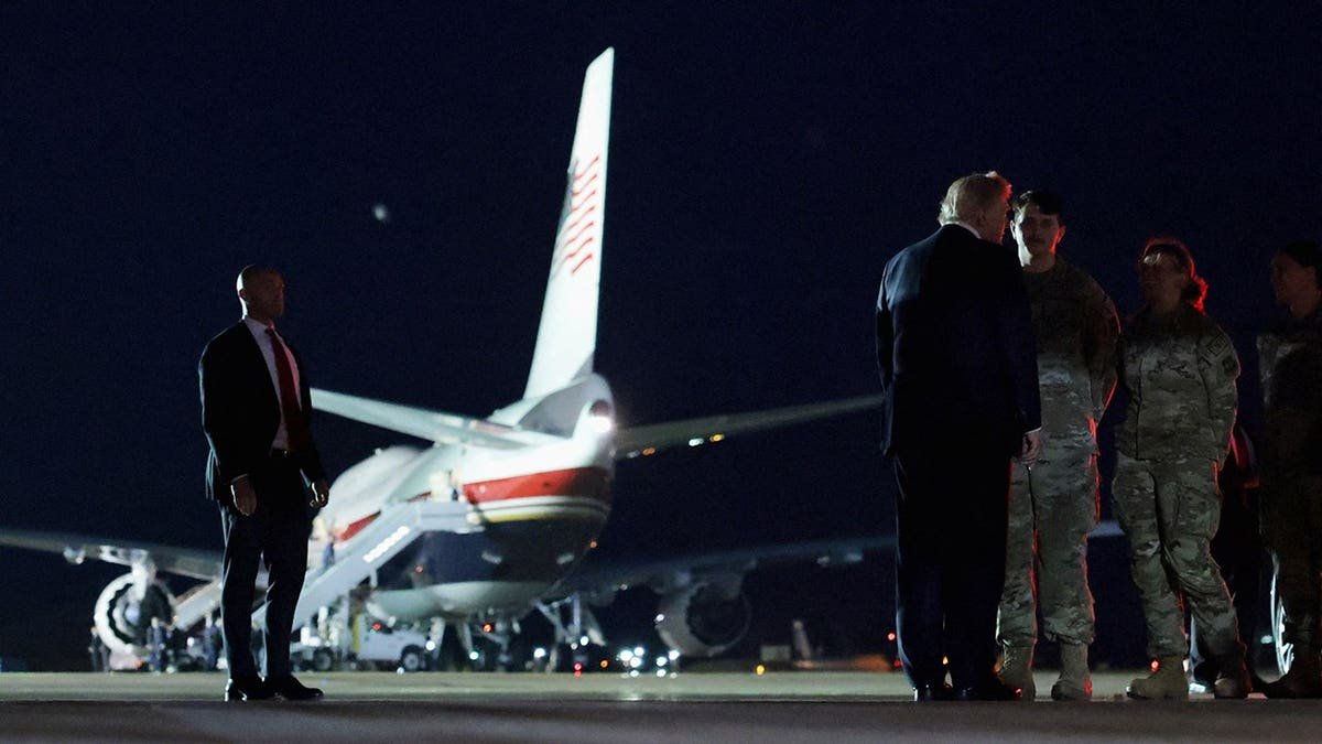 Donald Trump greets security forces members at RAF Mildenhall.