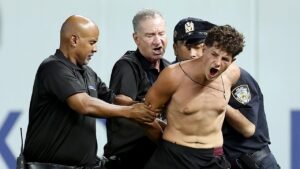 Three fans storm Yankee Stadium field as security springs into action, takes down intruders in epic fashion