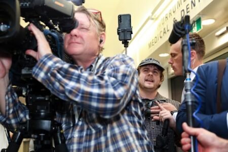 Exclusive Brethren secretly paid far-right activists to perform stunts disrupting the federal election