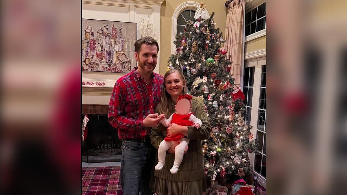 Portrait of Brooke Hanlon, with her husband and baby