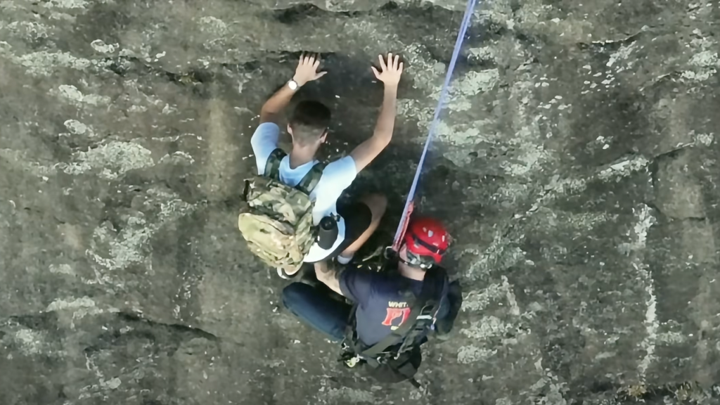 Free climber stranded on Georgia rock face calls 911, prompting dramatic rescue by firefighter