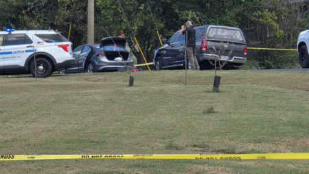 Police fatally shoot sword-wielding man after woman found trapped in car, officials say Police fatally shoot sword-wielding man after woman found trapped in car, officials say