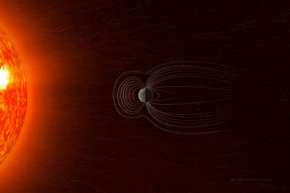 An animation of Earth’s magnetic field protecting the planet from a blast of radioactive solar wind.