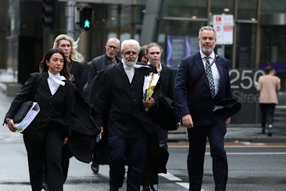 Erin Patterson’s new legal team led by  Richard Edney (centre) outside court on Wednesday.