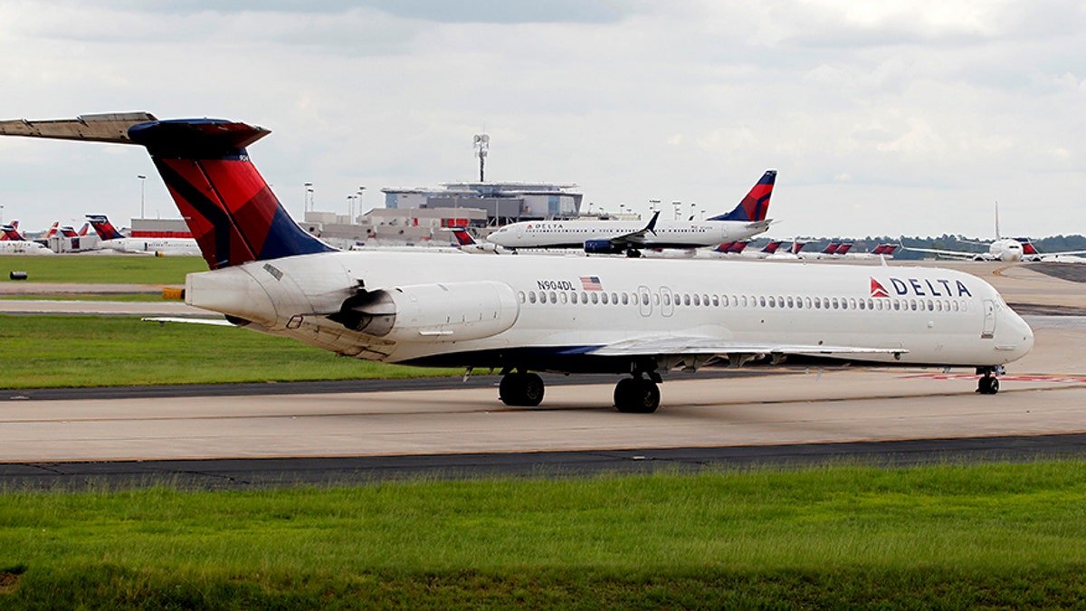 Delta airplanes line up on the taxi way after Delta Air Lines' computer systems crashed on Monday, grounding flights around the globe, at Hartsfield Jackson Atlanta International Airport in Atlanta, Georgia, U.S. August 8, 2016. REUTERS/Tami Chappell - TM3EC88149G01