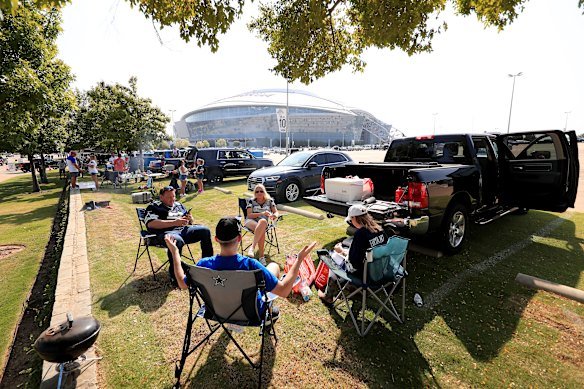 Fans tailgate in the car park before a Dallas Cowboys game in Arlington, Texas. 