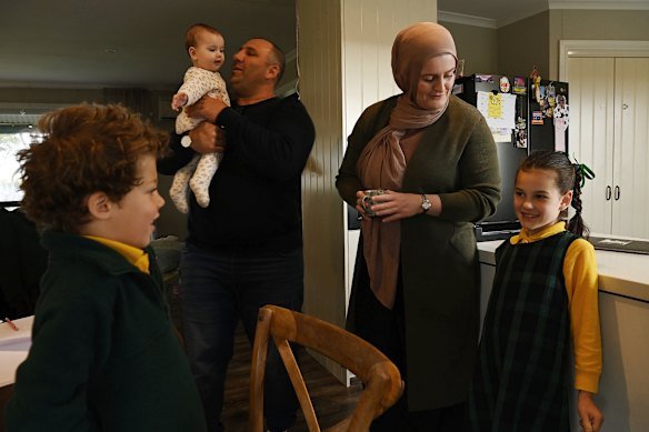 Omar Kowaider and wife Joanne with children Hakeem (left), Hannah and Layla as they get ready for the school day. 