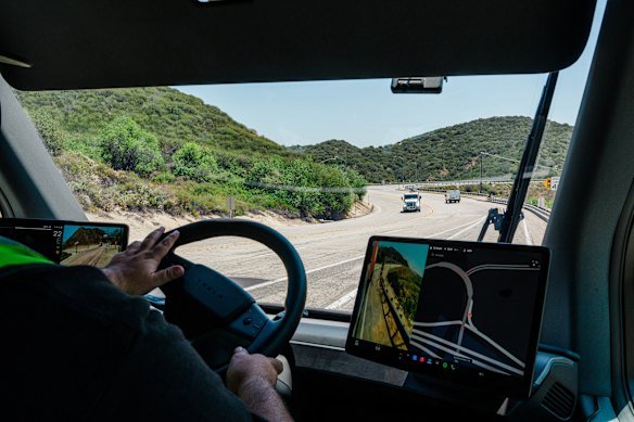 Tesla’s Semi has screens on either side of the steering wheel that provide a view of the traffic around the vehicle