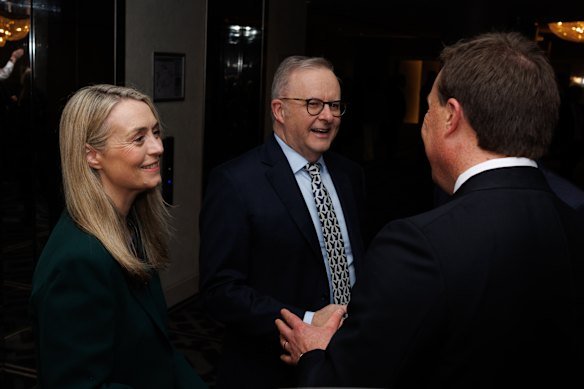 Jodie Haydon and husband Anthony Albanese are greeted by Bran Black.