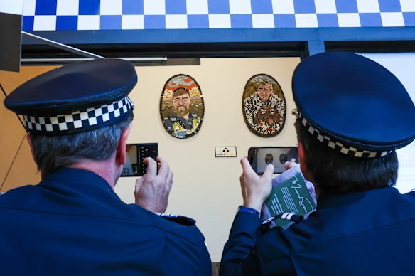 Two mosaics dedicated to the slain police officers have been revealed.