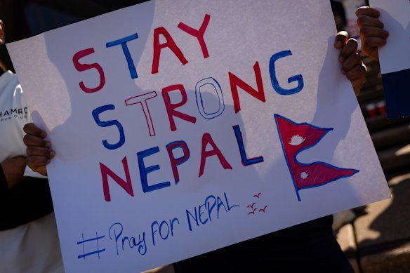 A supporter holds up a sign for Nepal.