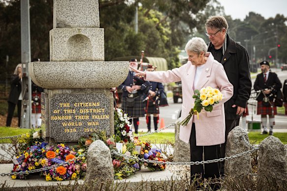 Never forgotten: Lynne Moore, with her son Craig Moore, lays roses in memory of her husband, Ray Moore, at Croydon war memorial on Sunday.