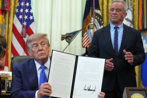 President Donald Trump holds an executive order about vaccines alongside Health Secretary Robert F. Kennedy jun.
