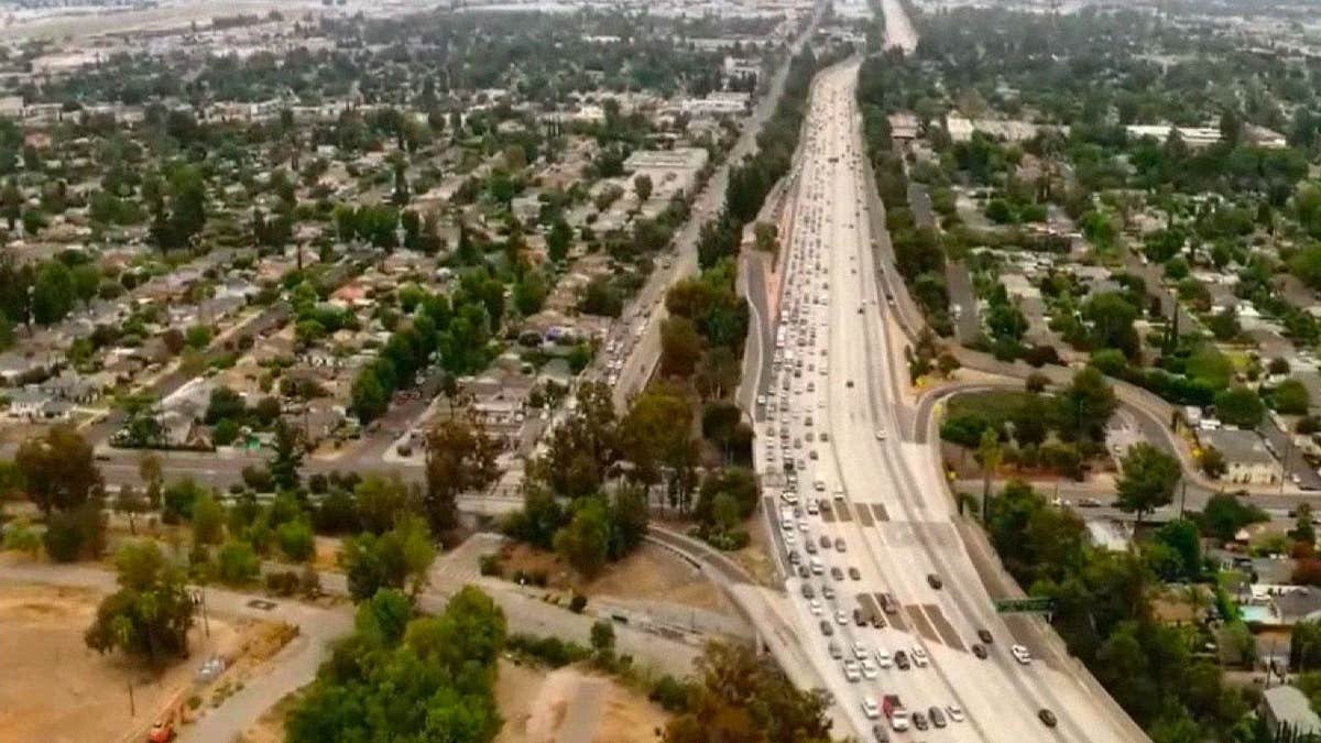 Traffic backs up along the 405 Freeway in Los Angeles after a crash involving two overturned cars