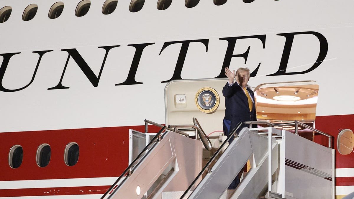 Donald Trump boards Air Force One at RAF Mildenhall.