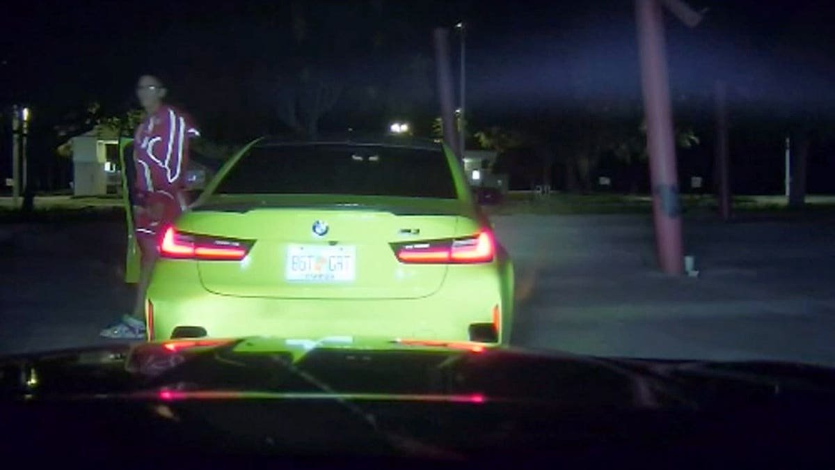 A Florida Highway Patrol dashcam captured Yulian Lugo exiting a green BMW after a high-speed pursuit following an Interstate 75 street takeover.