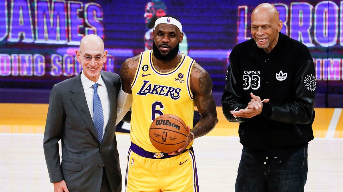 LeBron James takes a picture after becoming the NBA's all-time leading scorer