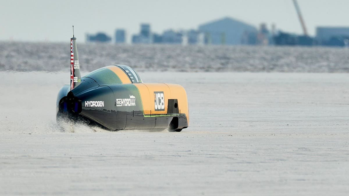 The car moves on salt flats.