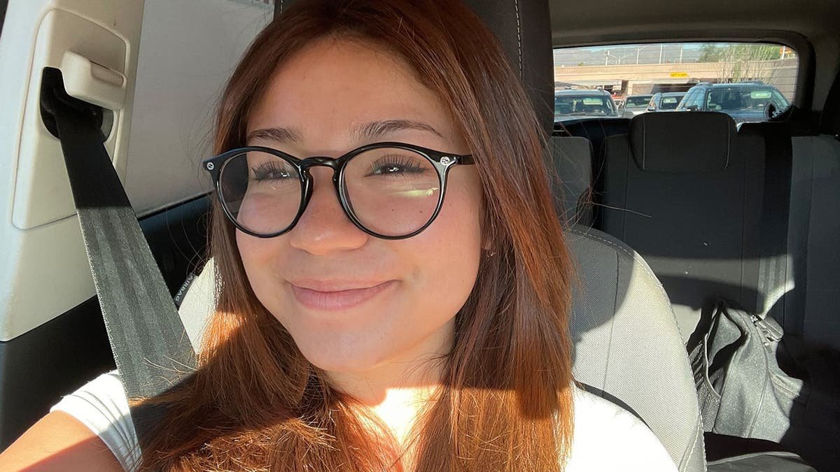 image shows Julie posing for selfie
