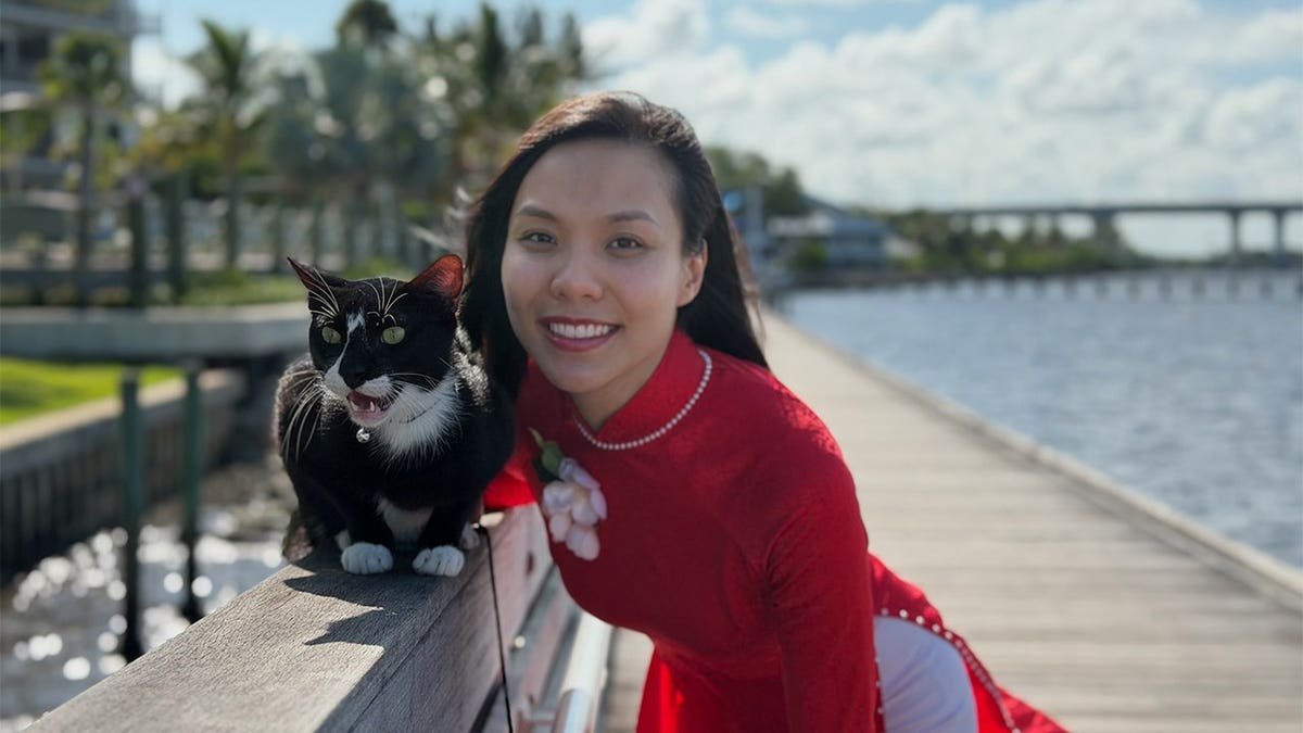 Florida woman Linh Nguyen with rescued pet Patchy