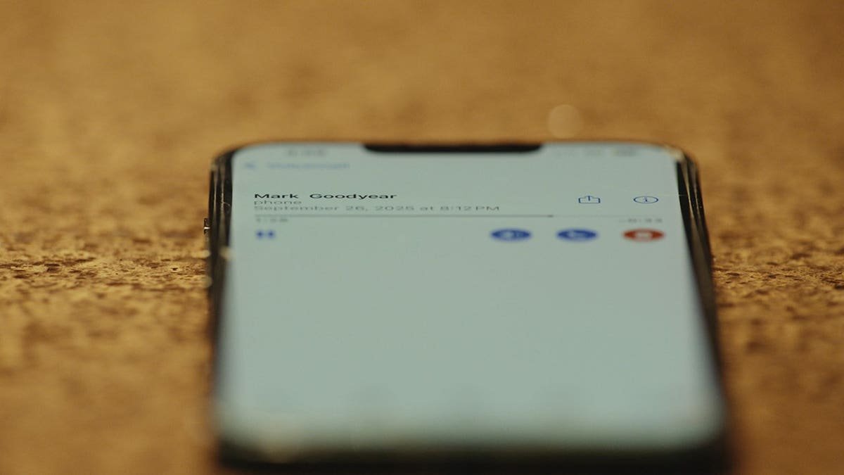 Phone showing a voicemail from Mark Goodyear.