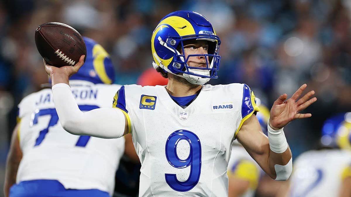 Matthew Stafford throwing a pass during an NFL playoff game