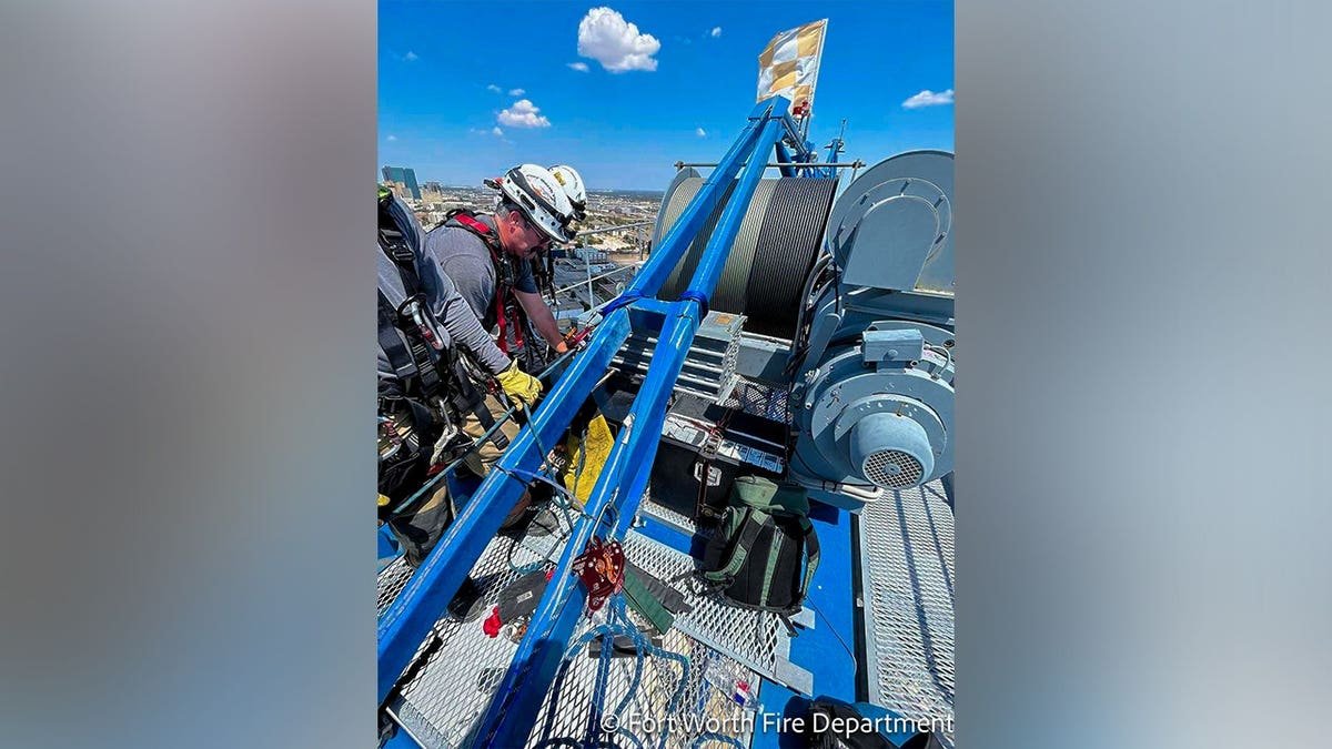 The Fort Worth Fire Department shared photos in a Facebook post that described a rescue operation to lower an individual from a towering crane.