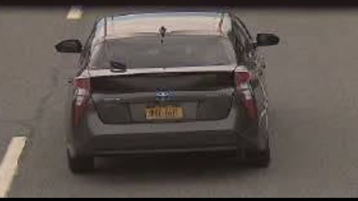 image shows car with NY tags