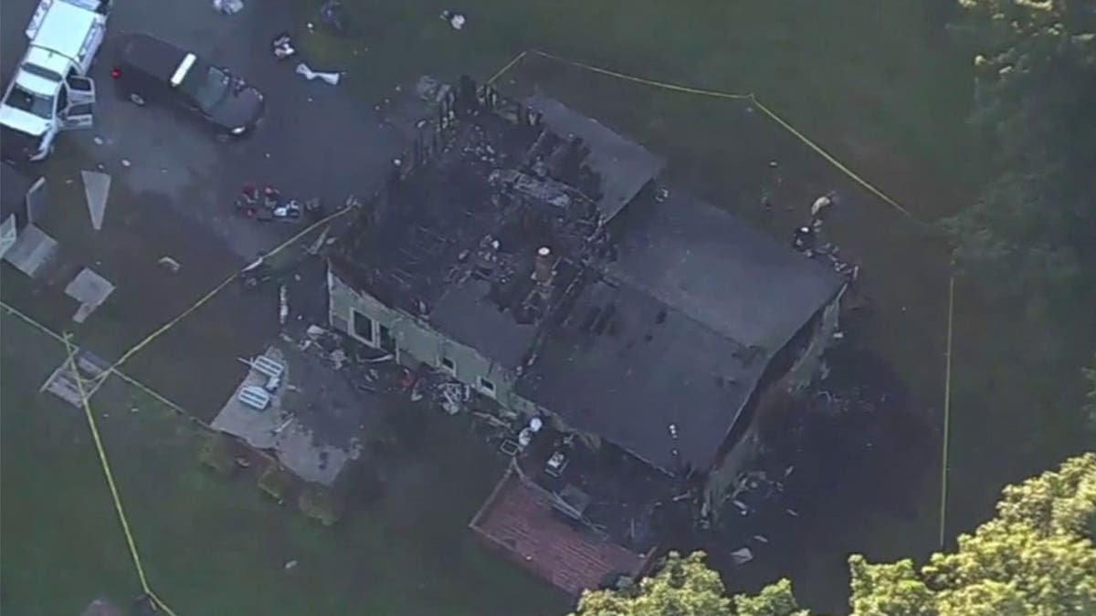 image shows aerial view of burned home