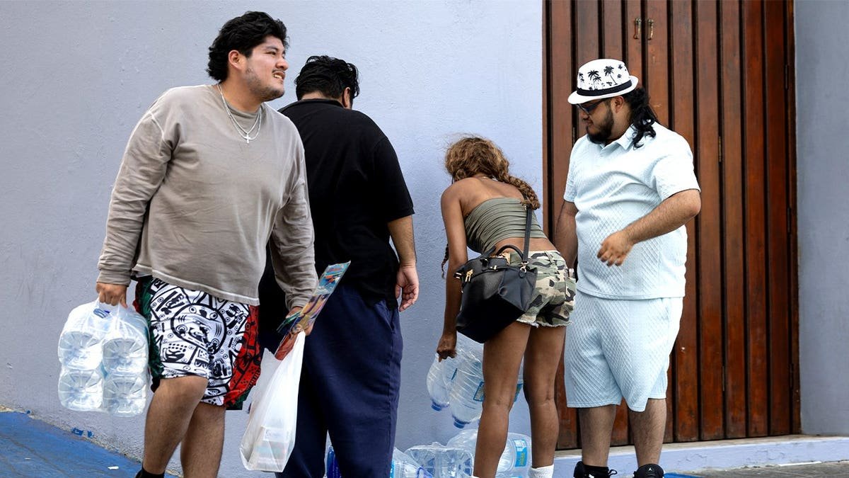 Tourists carrying water bottles in Puerto Rico