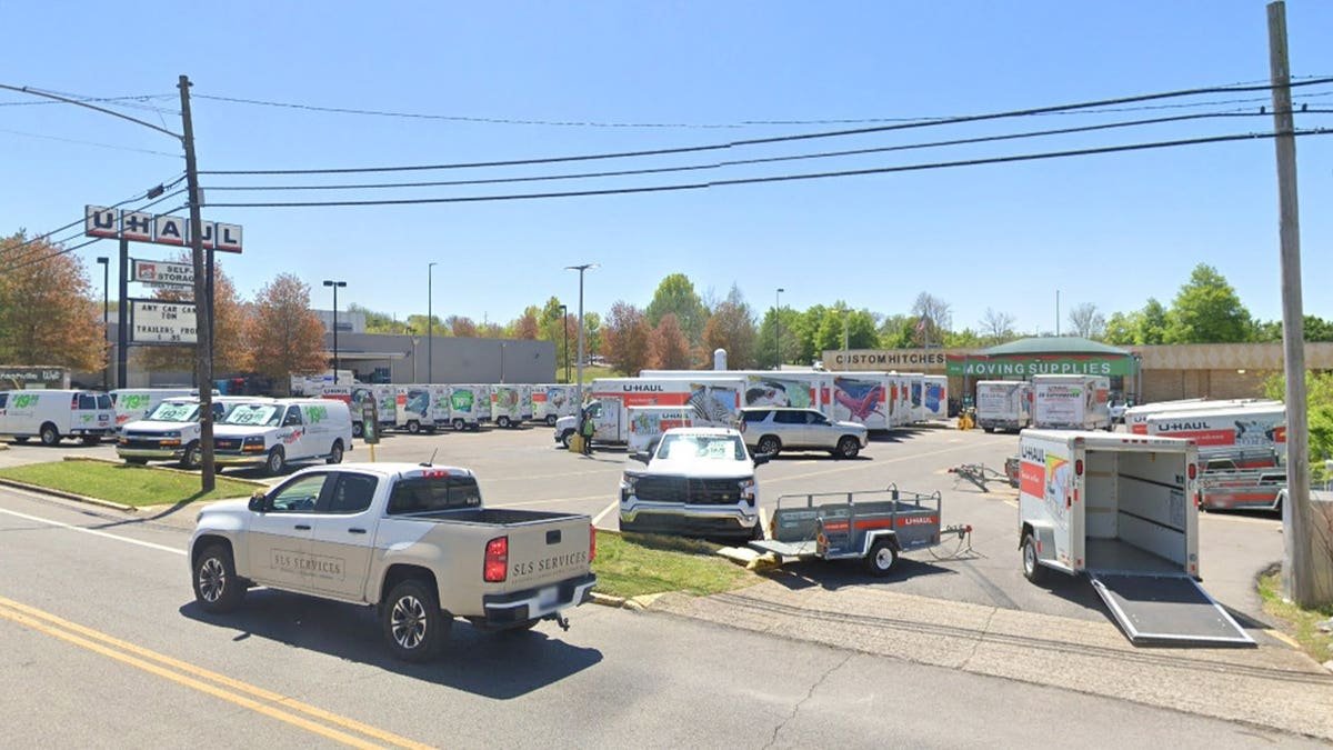 A U-Haul rental and self-storage lot in Nashville, filled with moving trucks, vans and trailers under a clear blue sky.