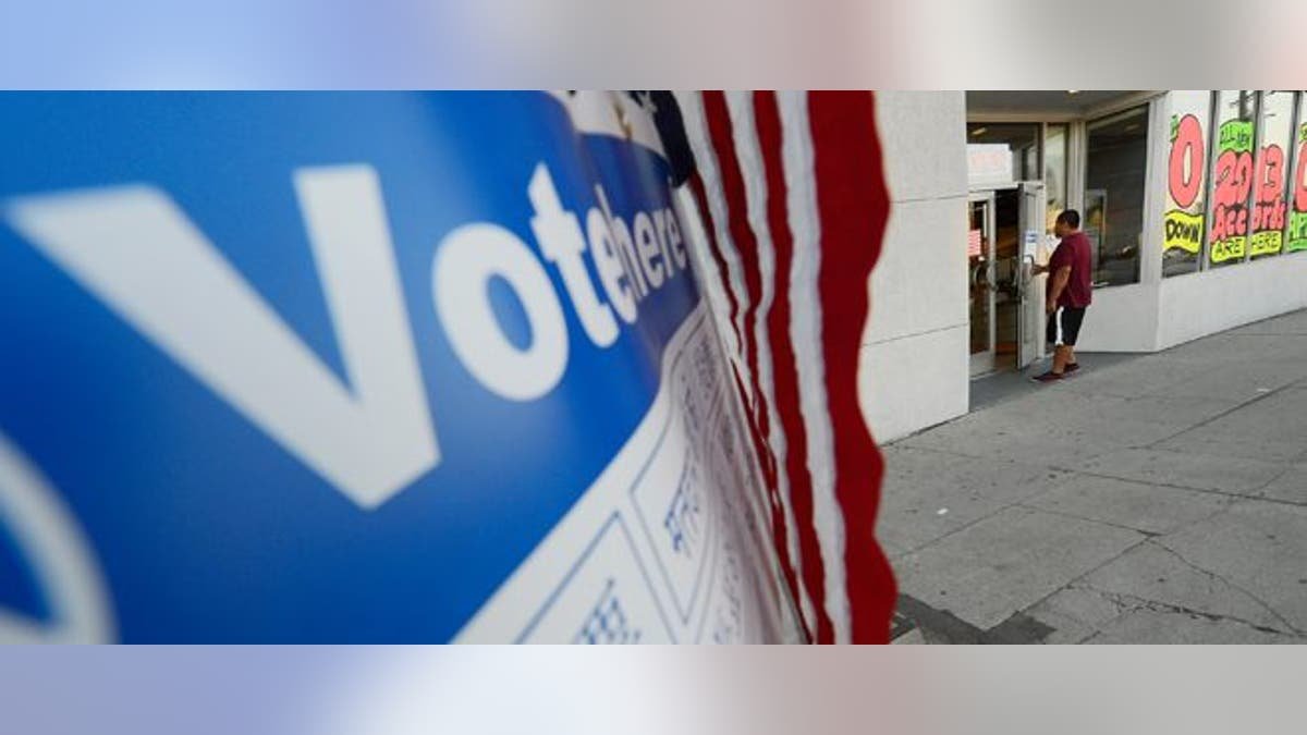LOS ANGELES, CA - NOVEMBER 06: A voter walks into the polling place at Robertson Honda car dealership to cast his ballot in the US presidential elections on November 6, 2012 in Los Angeles, California. Californians will cast ballots in dozens of tight races including Gov. Jerry Brown's tax plan, abolishing the death penalty, easing the state's strict 'three strikes' sentencing law and also in the Presidential race between Democratic President Barack Obama and Republican candidate Mitt Romney. (Photo by Kevork Djansezian/Getty Images)