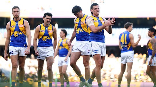 A dejected Eagles squad walks off ground after their loss to Richmond in round 21.