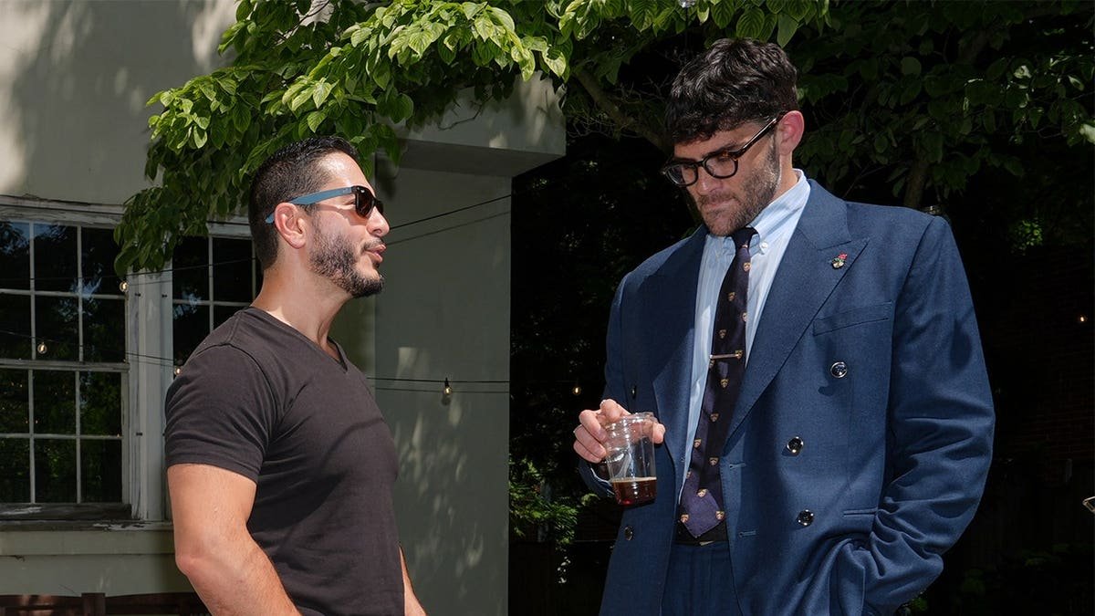 Abdul El-Sayed talks poolside with streamer Hasan Piker at a party in Detroit.