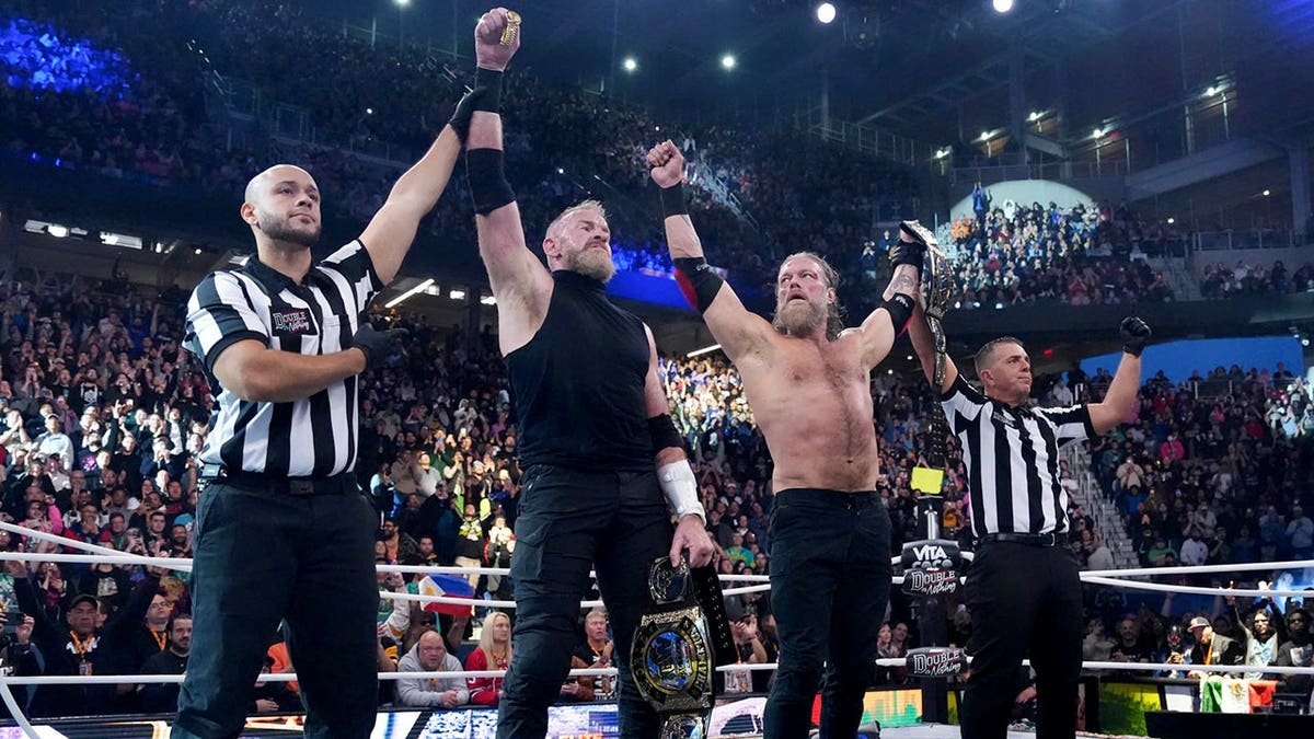 Adam Copeland and Christian Cage wrestling in a ring at AEW Double or Nothing in Queens