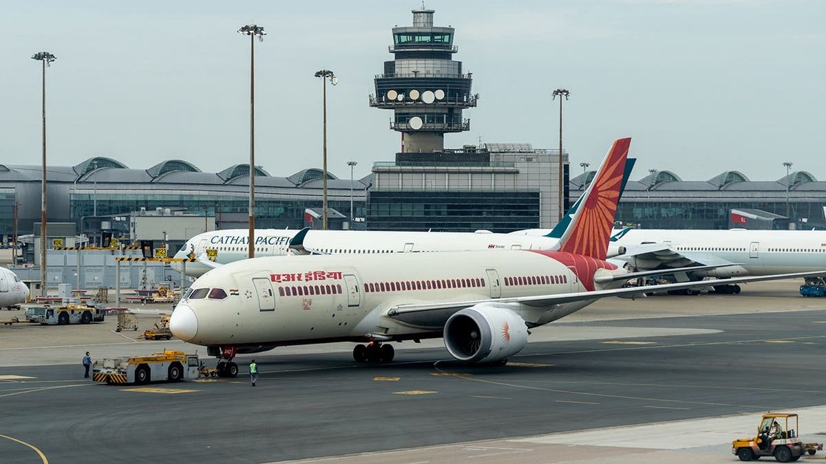 Air India Boeing 787-8 Dreamliner aircraft at Hong Kong International Airport.