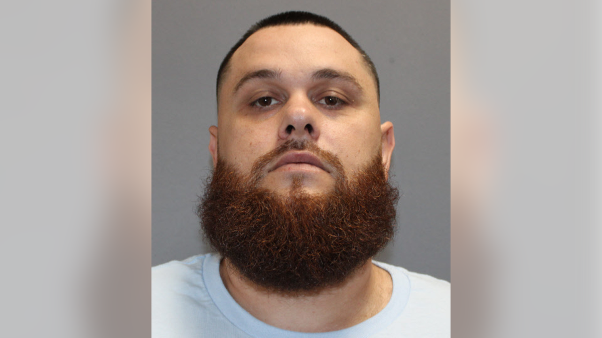 Alex James Barnett with a bushy beard and short cropped hair in his mugshot