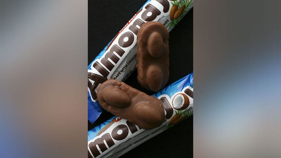 Almond Joy candy bars and packaging featuring the brand's coconut and almond ingredients