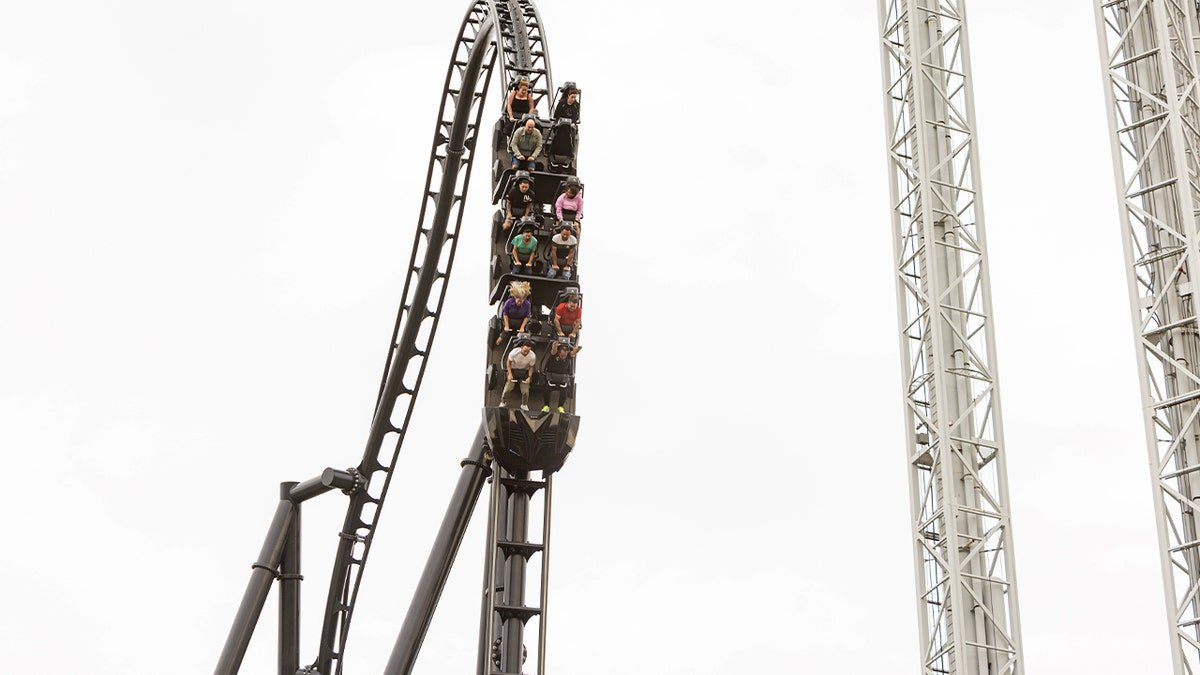 close up of ride with riders going down slope