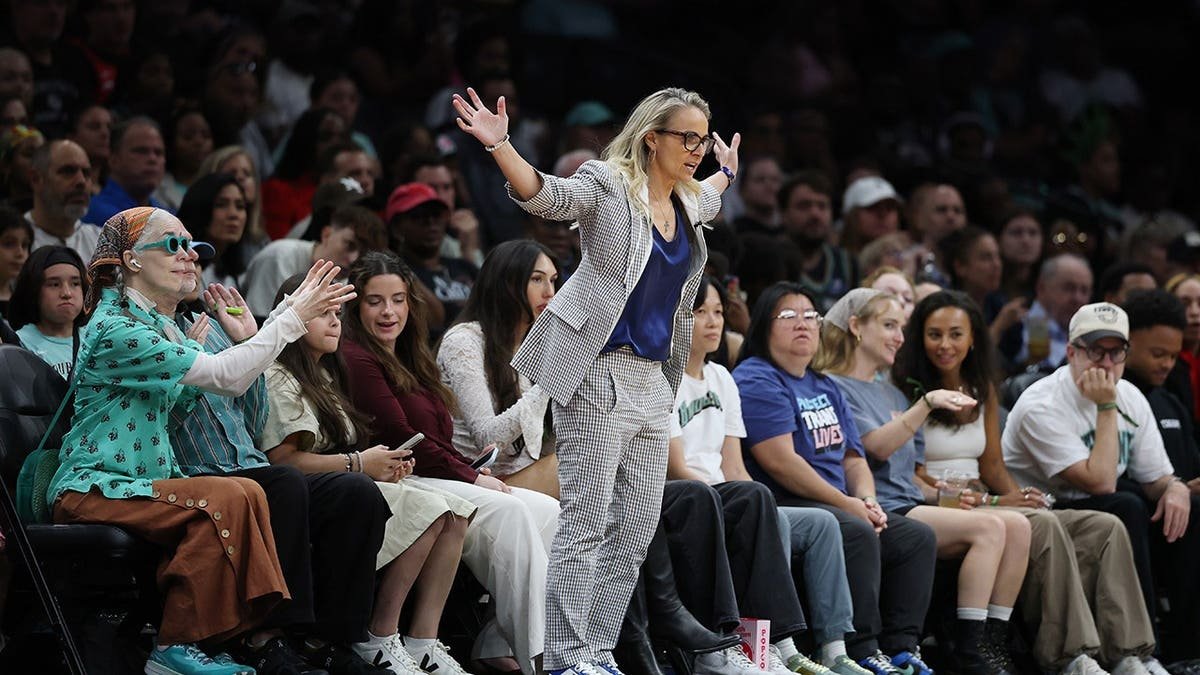 Becky Hammon, head coach of the Las Vegas Aces, looks on during a game.