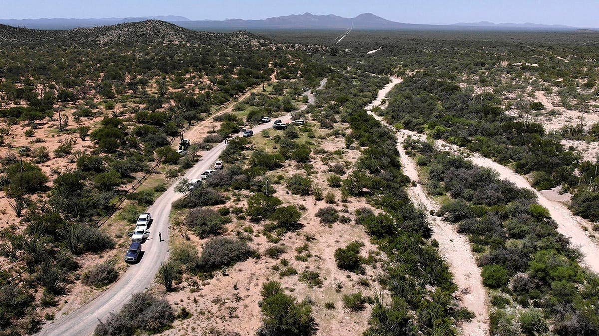 Contractors drill at a border wall pre-construction site in Arizona.