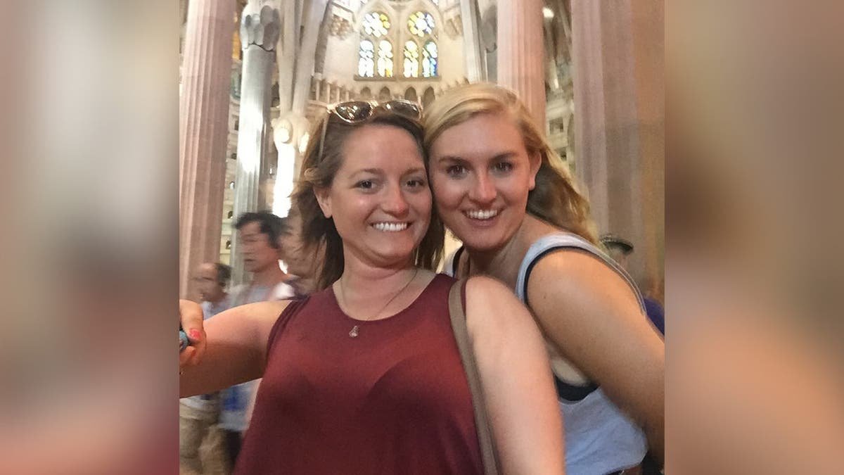 Brooke Hanlon and Jennifer Payne smile inside a church.