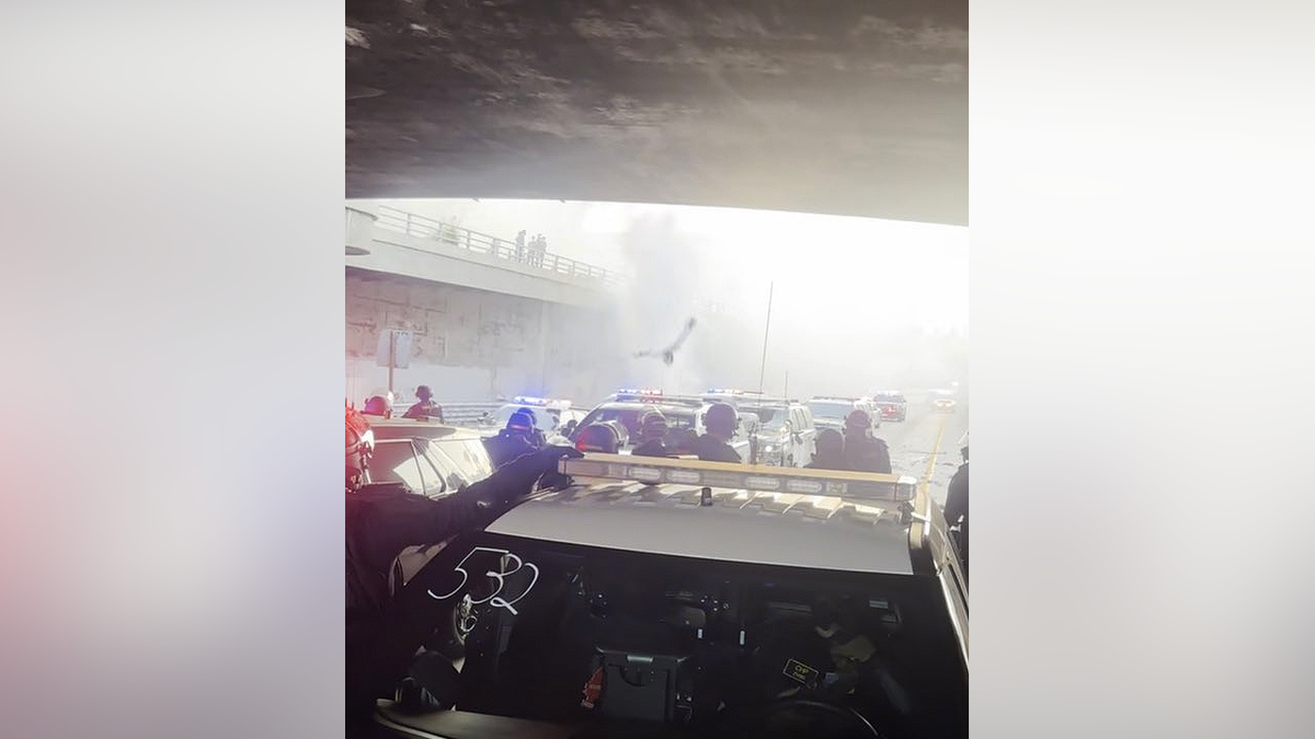 Burning debris falls toward CHP officers during Los Angeles anti-ICE riots