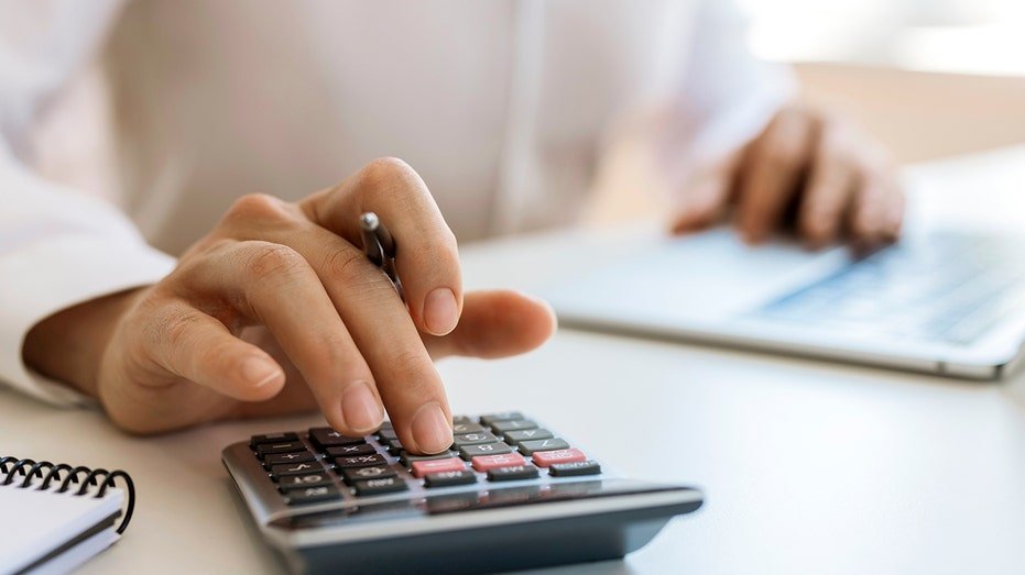Unrecognizable businessman calculating and planning at office