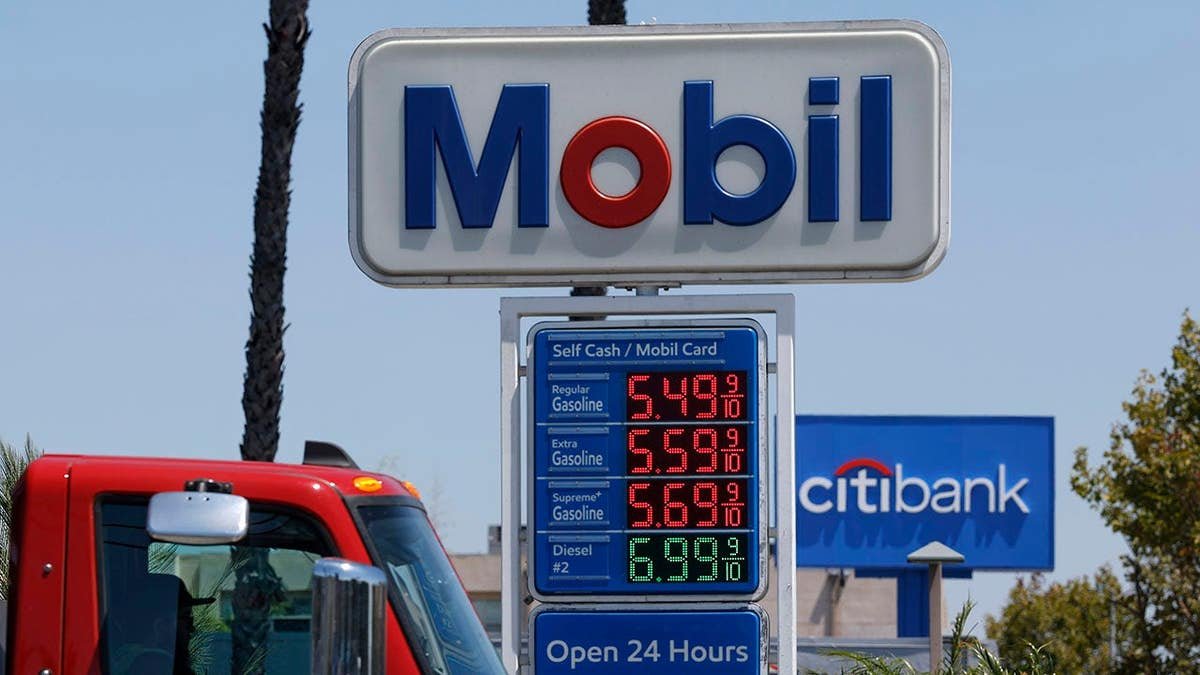 Gas prices displayed on a sign at a Mobil gas station in Los Angeles, California.