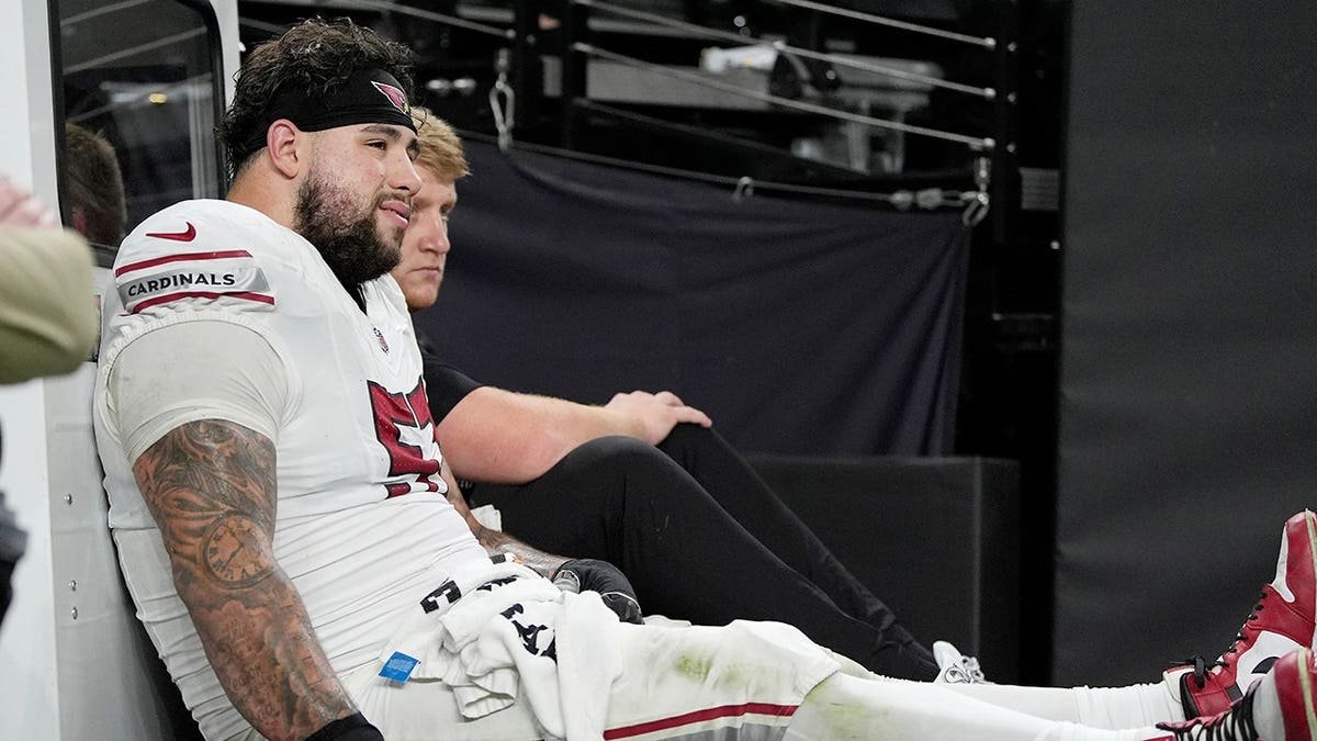 Chase Bisontis, Arizona Cardinals offensive lineman, is carted off the field during a preseason NFL game.