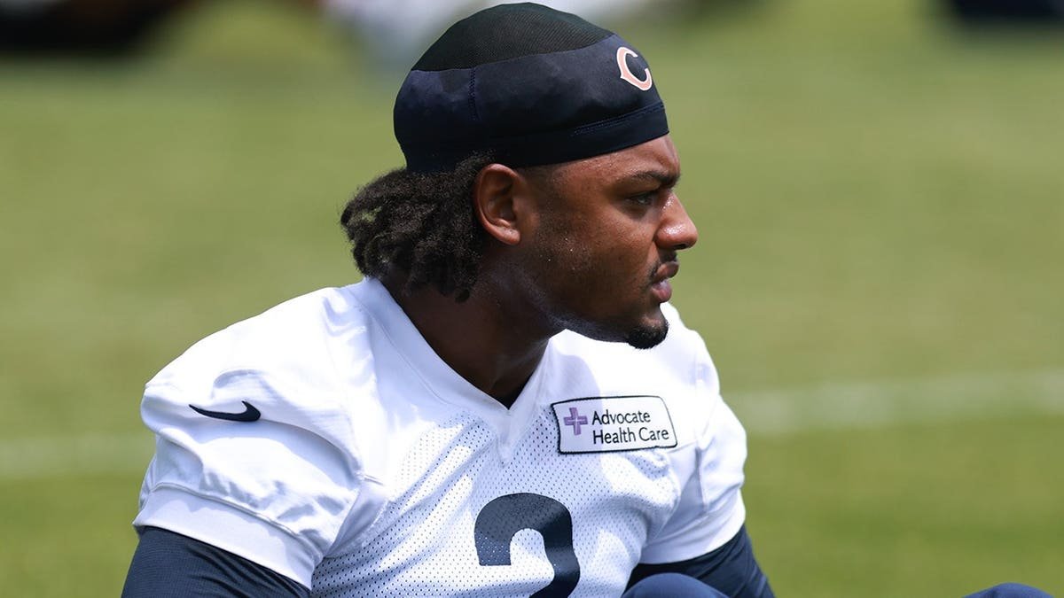 Coby Bryant stretches during a Bears OTA workout.