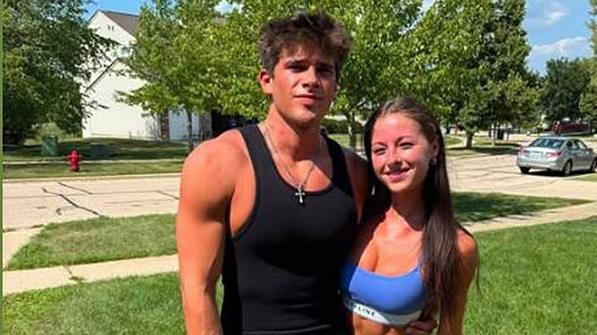 Thalman and Warick in workout clothes